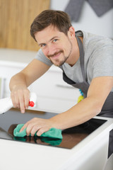 happy man with spray cleaner