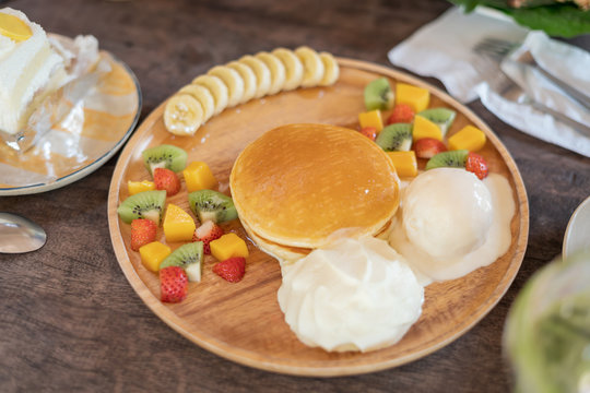 Fruit pancakes with ice cream on the table Served with cakes