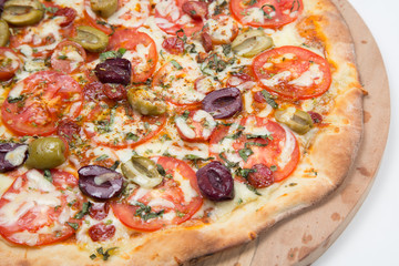 Vegetarian pizza or pizza with onions, mixed olives, mushrooms  and tomato with a white background