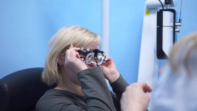 The doctor checks the eyesight of the patient. Foropter electronic automatic. Eye clinic. Health prophylaxis.