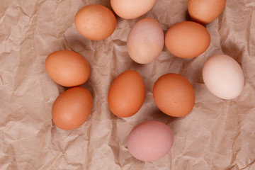 Village eggs. Kraft paper background