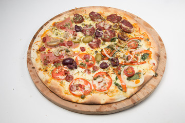 Salami pizza with mushrooms, onions, green olives  and tomato with white background