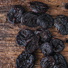 prunes, dried plums (tasty and healthy fruits) desiccated keto or paleo diet menu concept. background. top view. copy space