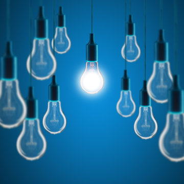Idea and teamwork concept - Vintage incandescent bulbs on color background