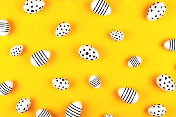 Easter composition. Beautiful painted eggs on bright yellow background.