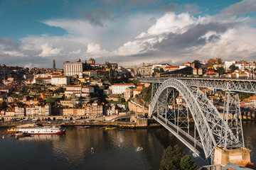 Fototapeta na wymiar View of Arched Luis I Bridge Carrying Low Level Road and a High Level Metro Line Between Porto and Vila Nova de Gaia Cities in Portugal