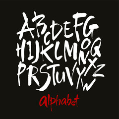 Vector Acrylic Brush Style Hand Drawn Alphabet Font. Calligraphy alphabet on a black background. Ink hand lettering.