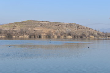 Former garbage hole becomes a hill,river landscape