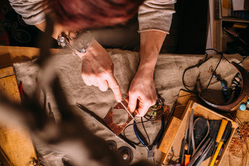 handmade copper wire working tools on the table with accessoires. handicraft people art concept