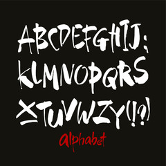 Vector Acrylic Brush Style Hand Drawn Alphabet Font. Calligraphy alphabet on a black background. Ink hand lettering.