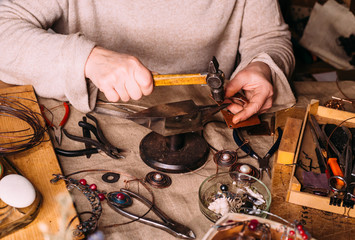 handmade copper wire working tools on the table with accessoires. handicraft people art concept