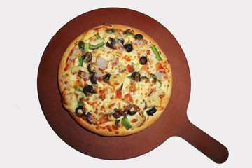 fresh pizza on a pizza holder