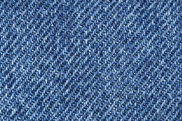 Blue jeans fabric macro. Denim jeans texture or denim jeans background.