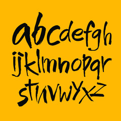 Vector Acrylic Brush Style Hand Drawn Alphabet Font. Calligraphy alphabet on a yellow background. Ink hand lettering.