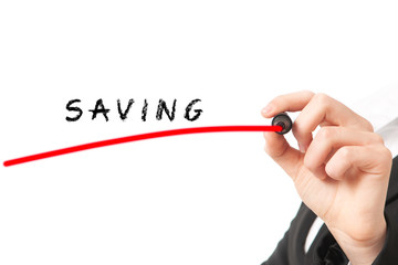 Hand with pen writing saving