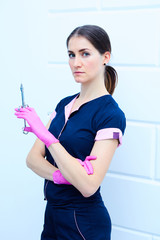 portrait of young female dentist in office