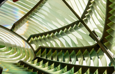 Close image of the glass prisms making up a fresnel lens in a lighthouse