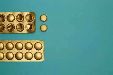 blister packs and medicine pills on blue background