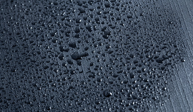 macro grey nylon with water drops, nylon fabric textured background closeup