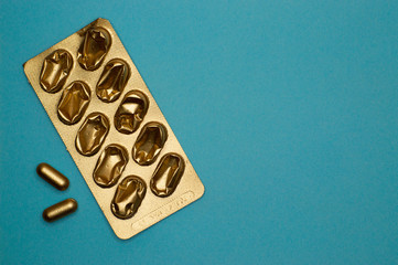 empty blister pack and pills on blue background - 327924837