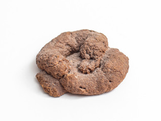 An artificial toy piece of shit isolated on white