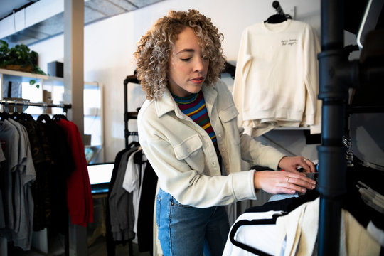 Young Woman Shopping In Clothing Store