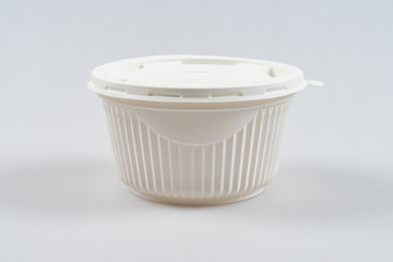 Disposable, plastic, white soup container isolated on a white background.