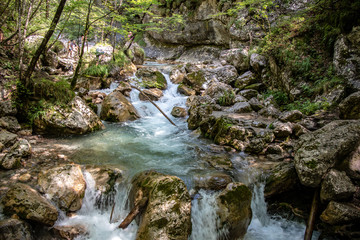 View of wild brooks and rivers in a gorge in the swiss and austrian Alps, Europe.
