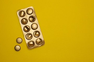 blister pack and pills on yellow background - 327927458