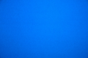 Bright blue background.Red cardboard texture.