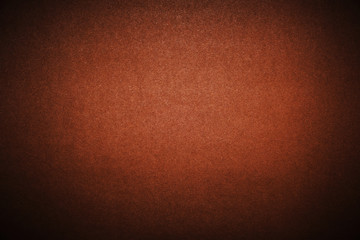 Fototapeta premium Bright brown background with vignetting. The texture of the cardboard.