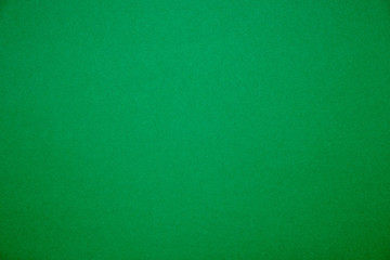 Bright green background.Red cardboard texture.