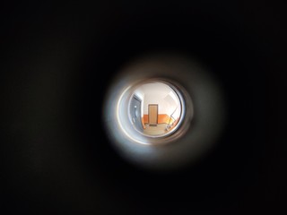 View to the hall through peephole eyelet in the door. Slovakia