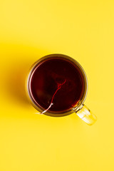 Fruit tea in glass mug.
