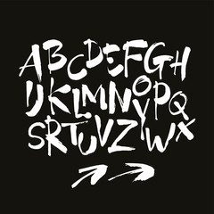 Vector Acrylic Brush Style Hand Drawn Alphabet Font. Calligraphy alphabet on a black background. Ink hand lettering.