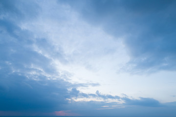 Naklejka na ściany i meble Beautiful sky with stretched clouds during twilight.