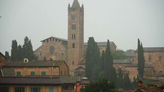 Rainy weather on streets of old traditional town in Italy. Raining dropping