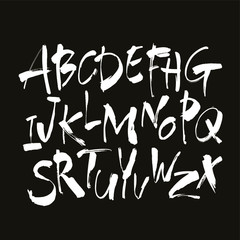Vector Acrylic Brush Style Hand Drawn Alphabet Font. Calligraphy alphabet on a black background. Ink hand lettering.