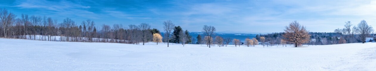 Fototapeta na wymiar Panoramic view of a winter scene on the shore of Lake Champlain 