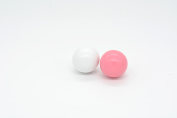 two small balls on a white background