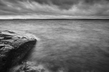 Long exposure Black and white photo of cliffs and lake