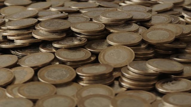 Bed of mexican 10 pesos coin rotating