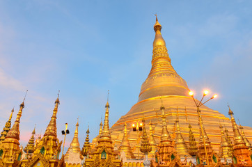 Shwedagon Pagoda at sunset, Yangon, Myanmar. One of Buddhism's most sacred sites with the 105 m high zedi (stupa). Important landmark and tourist attraction.