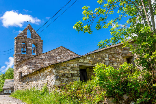 Selective focus of the Iglesia de San Juan or Church of San Juan in Padornelo, Province of Lugo, Galicia, Spain on the Way of St. James, Camino de Santiago, rear view, blurred bell gable