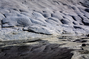 Black rock formations the phenomenon of nature from the frozen lava in the form of pentagons. 