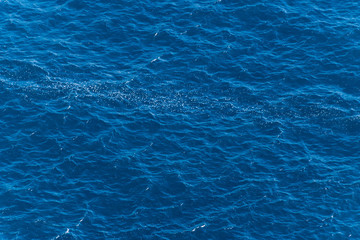 A close-up shot of the Mediterranean Sea waves and the turquoise water