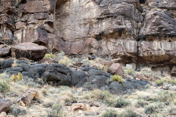 Black Volcanic  Lava Flow solidified into solid Rock. These dark stones are located in White River Narrows, Basin and Range National Monument, Nevada, USA.
