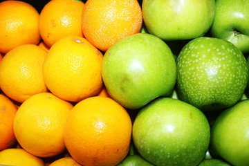 orange fruits and green apple close up image