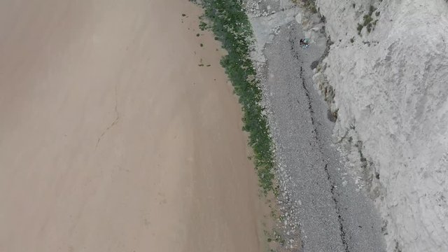 Aerial footage on the beach of Escalle, Cap Blanc Nez, France, white cliffs seeing the ferry to England in the distance