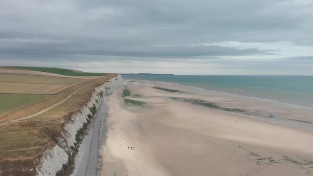 Aerial footage on the beach of Escalle, Cap Blanc Nez, France, white cliffs seeing the ferry to England in the distance